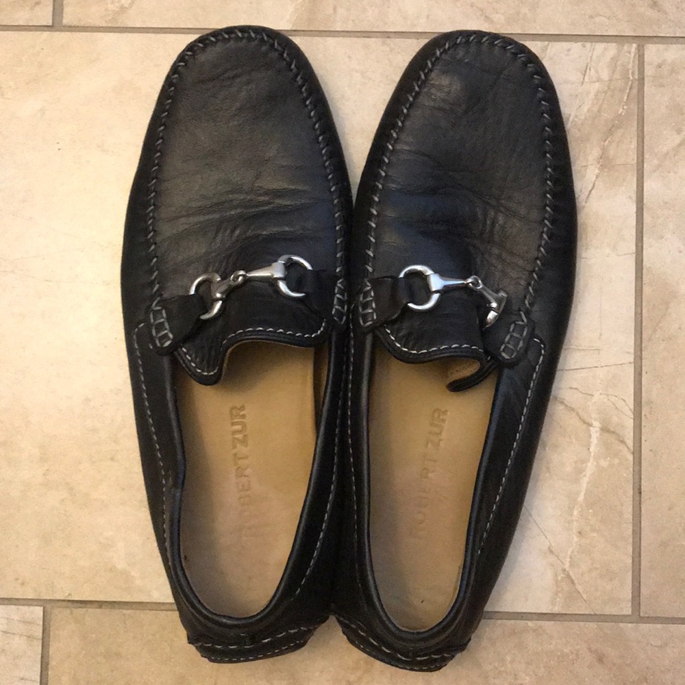Men’s black loafers.